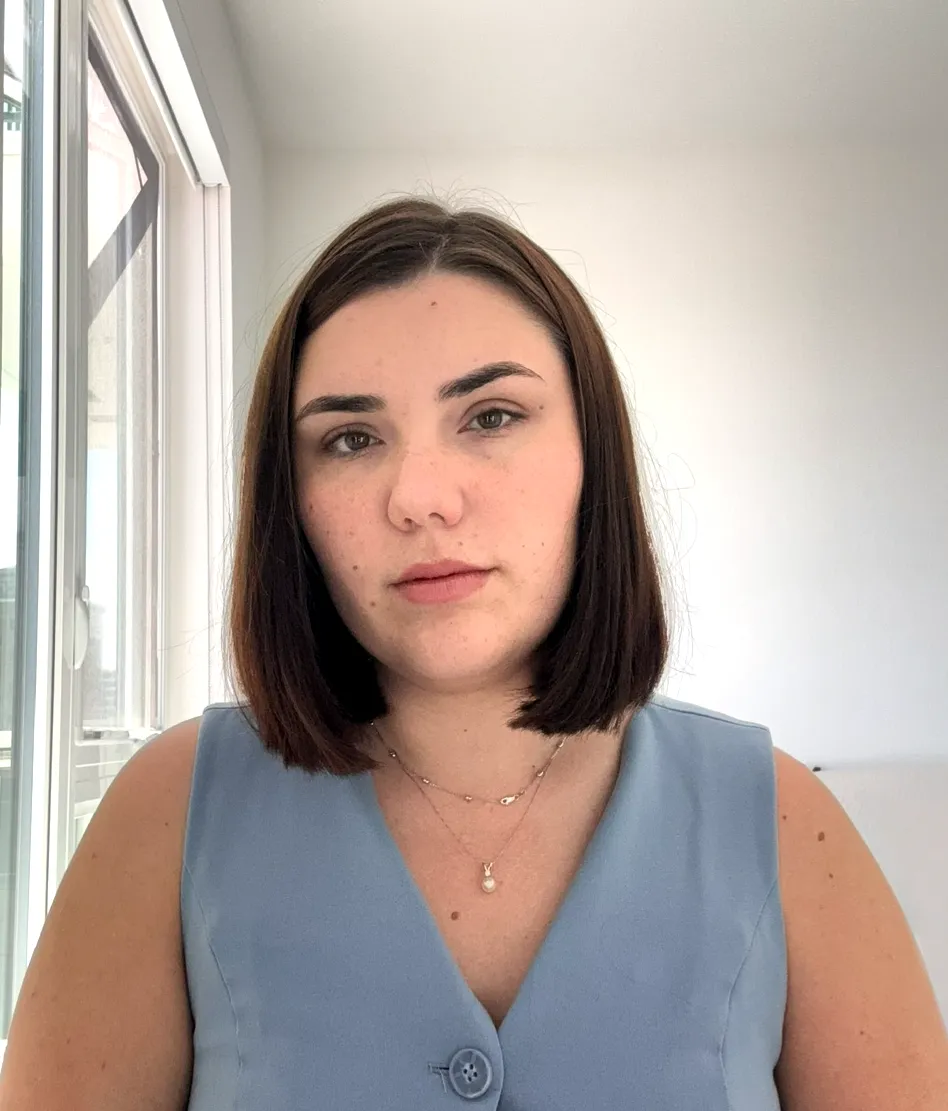 Portrait of Sofiia Blazhko, co-founder of Decode Nation, with shoulder-length dark hair